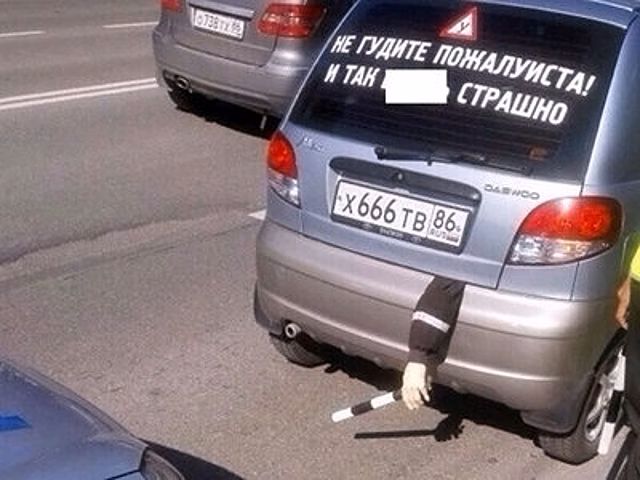 По Сургуту ездит авто, из багажника которого торчит рука гаишника с жезлом